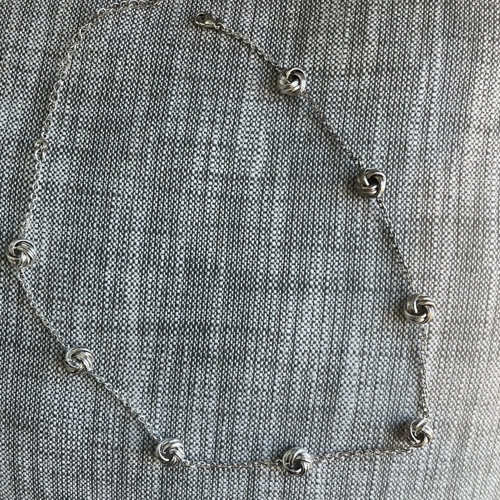 Silver costume knotted necklace